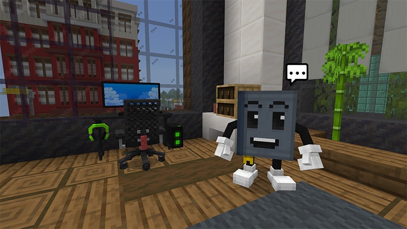 Two characters in the Good Game world beside a gaming setup, with a chat bubble above them